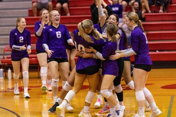 Volleyball team celebrating.